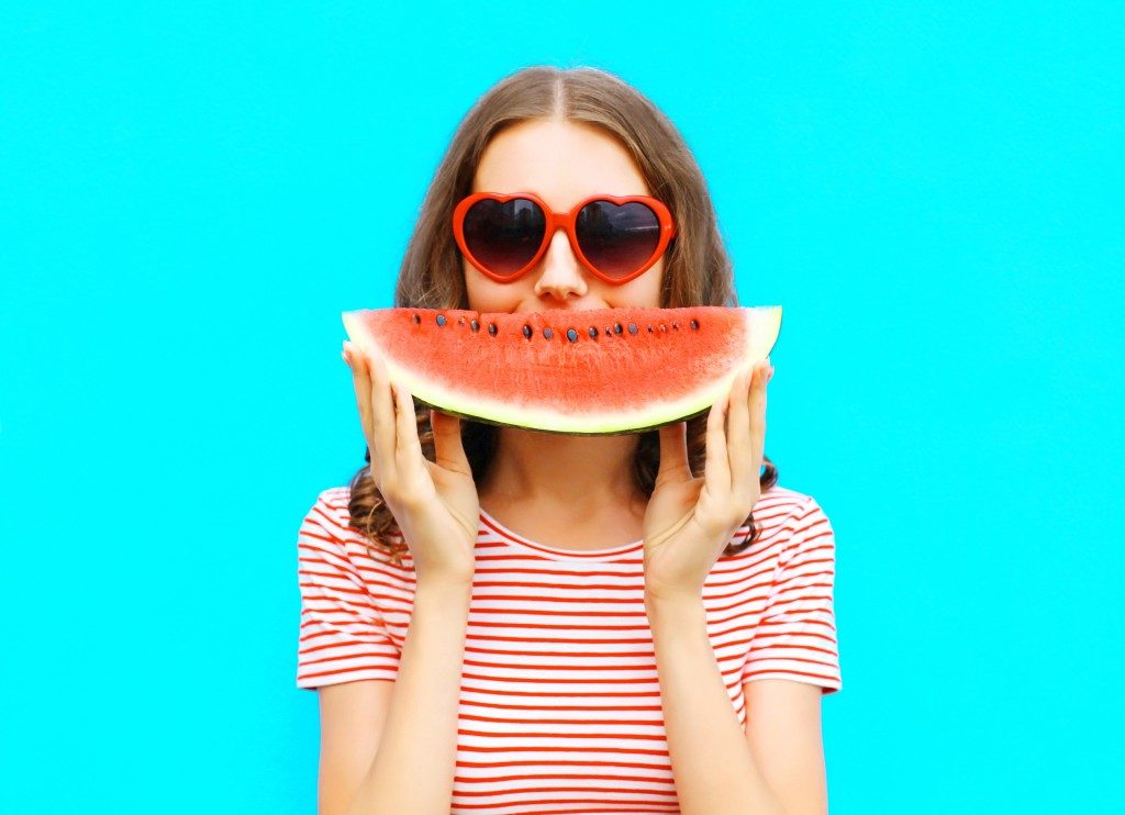 girl eating a watermelon