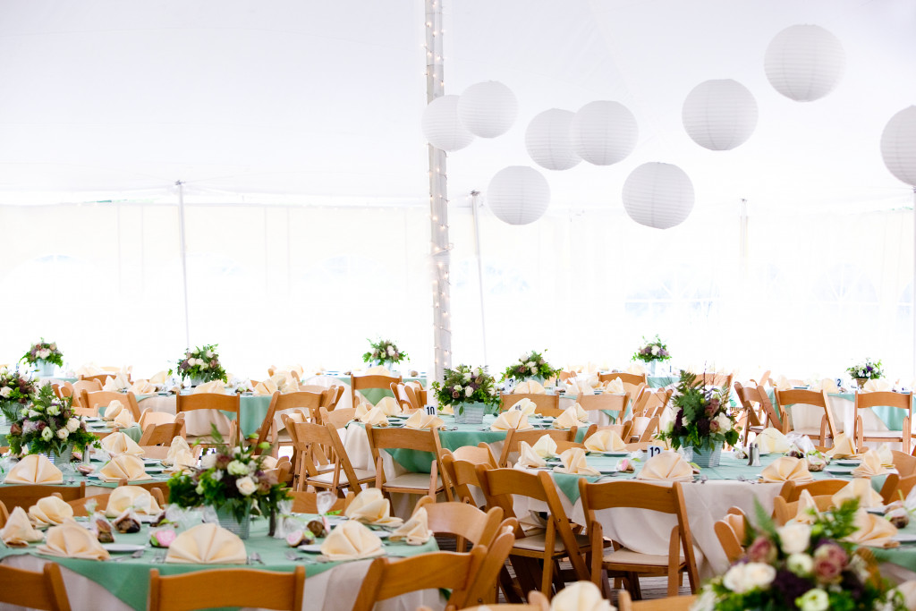 A look inside a tent set for fine dining during a wedding or other catered event